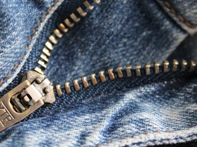 close-up-of-zipper-of-blue-denim-bottoms